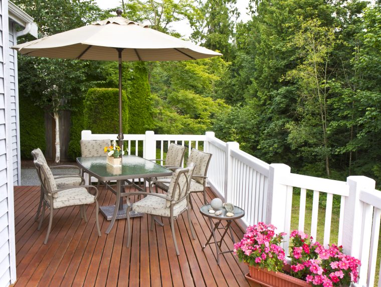 Outdoor patio setup on cedar wood deck Outdoor patio setup on cedar wood deck with trees in background
