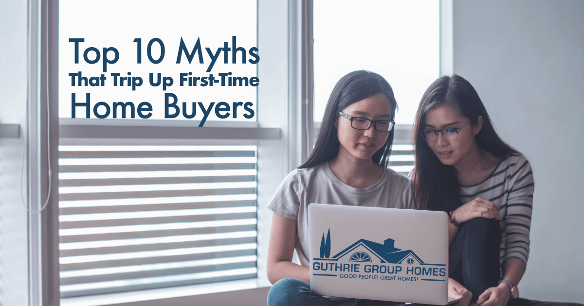 Two young Asian women searching Guthrie Group Homes, Real Estate website on a laptop